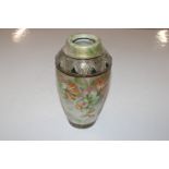 An Alexandra porcelain vase with all over floral d