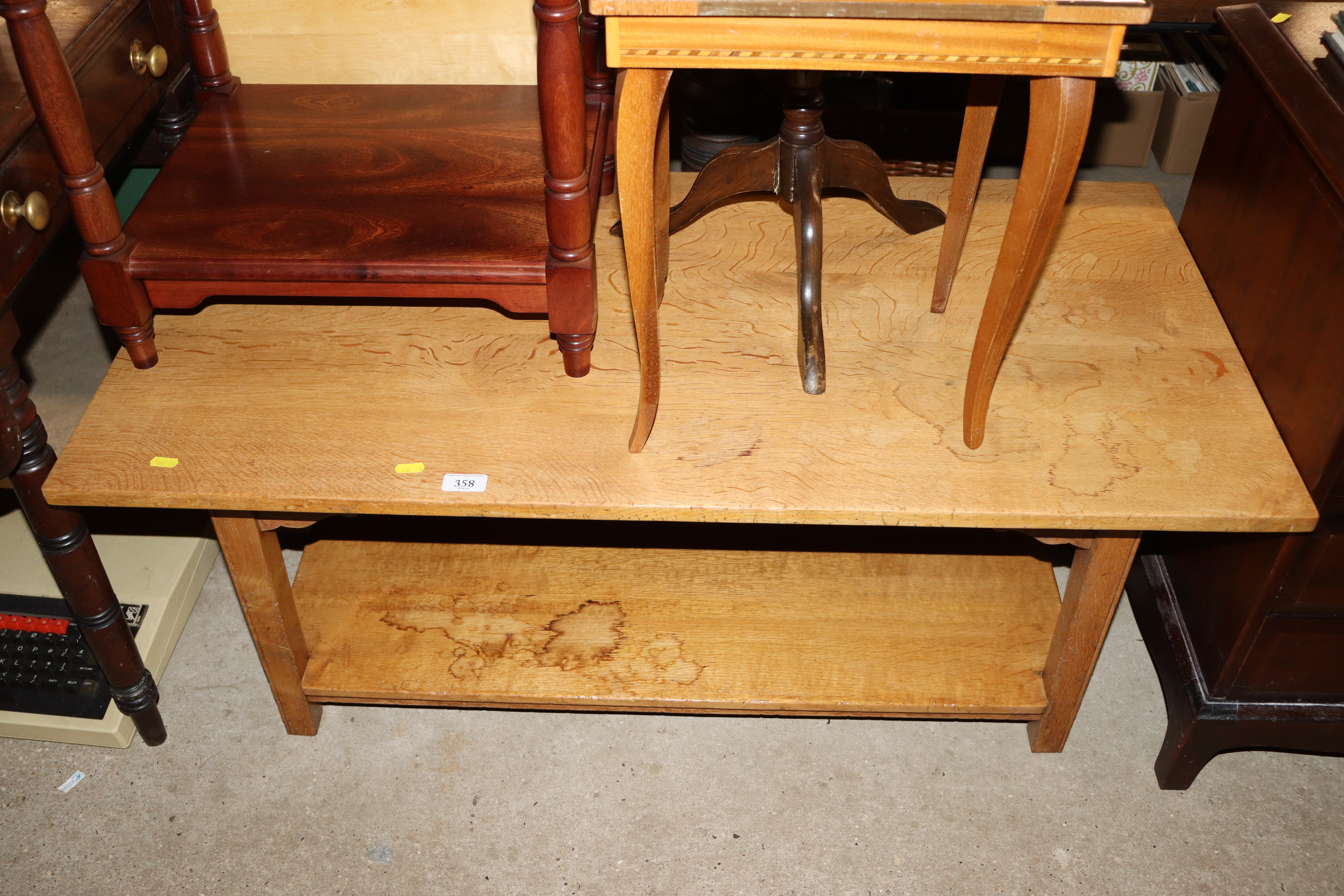 A lightwood two tier coffee table