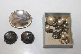 A pair of silver Art Nouveau style buttons; a yel