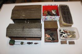 A box containing various farm animals and building