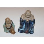 A Chinese part flambé glazed standing Buddha and a