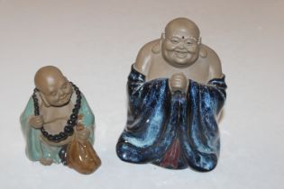 A Chinese part flambé glazed standing Buddha and a