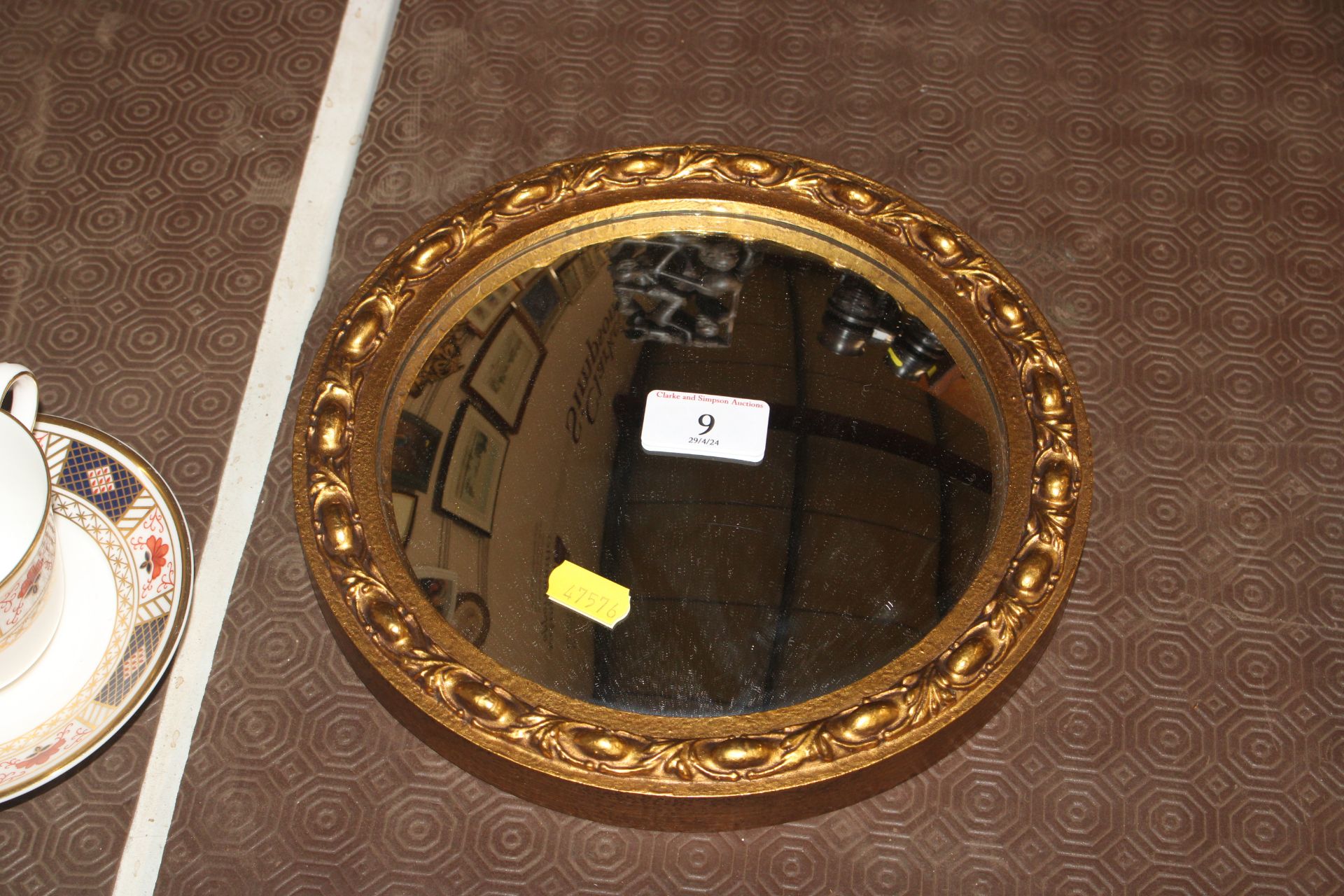 A small gilt framed convex wall mirror