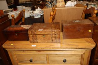 A mahogany sarcophagus shaped tea caddy; a walnut