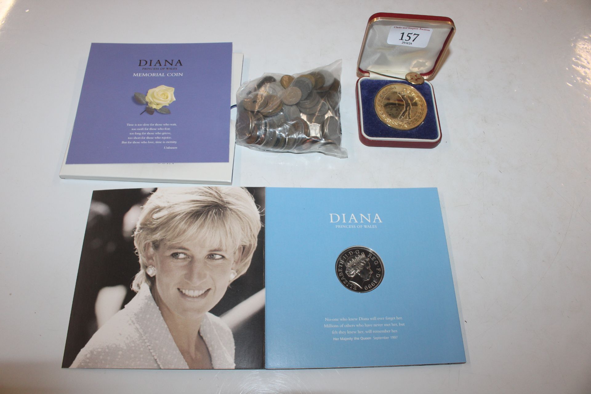 A Diana Princess of Wales memorial coin; a bag of