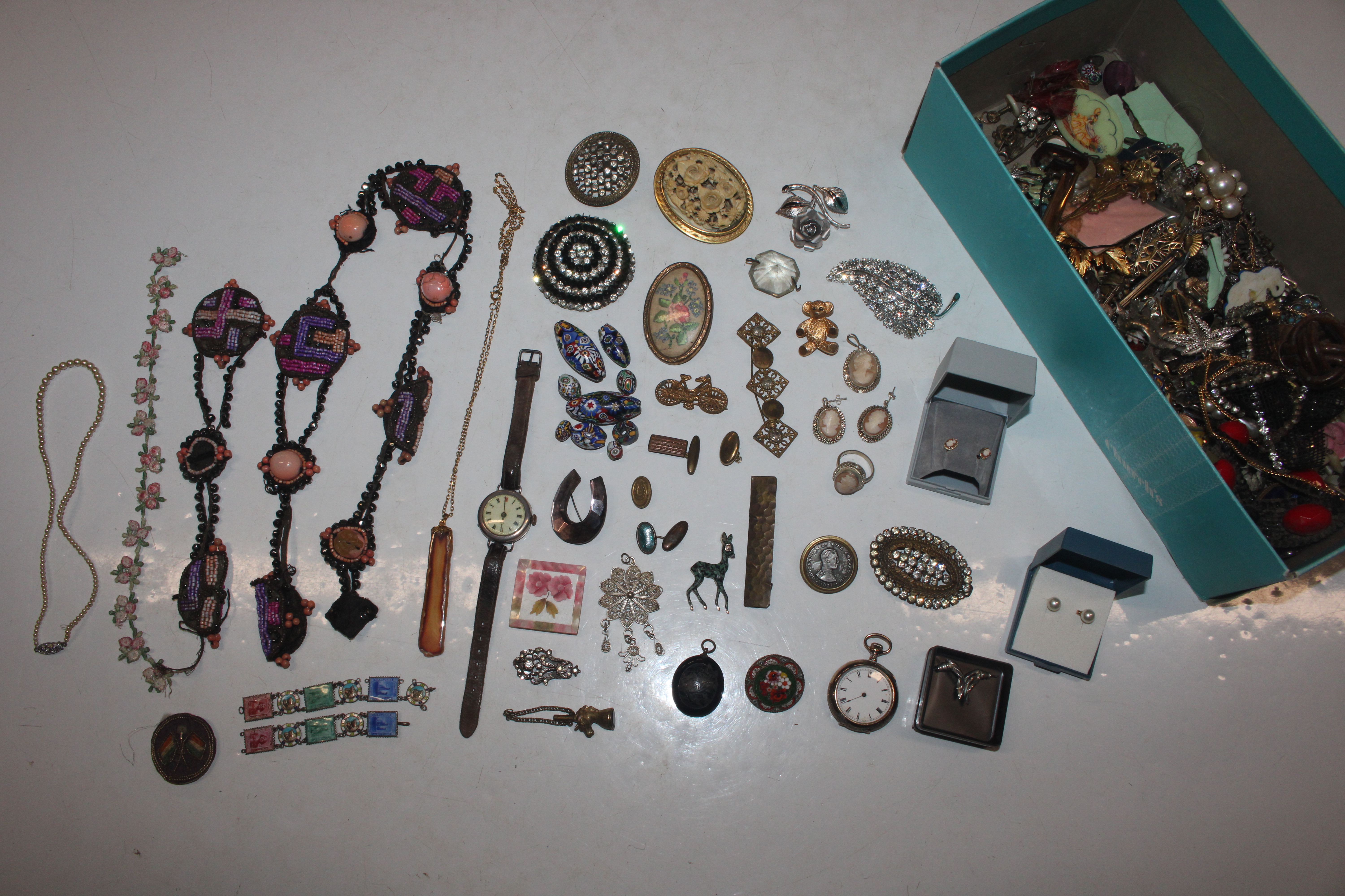 A box containing various costume jewellery; a micr