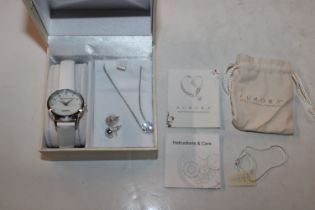 An as new and boxed Swarovski Aurora watch and pen