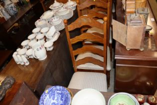 A set of six oak ladder back dining chairs