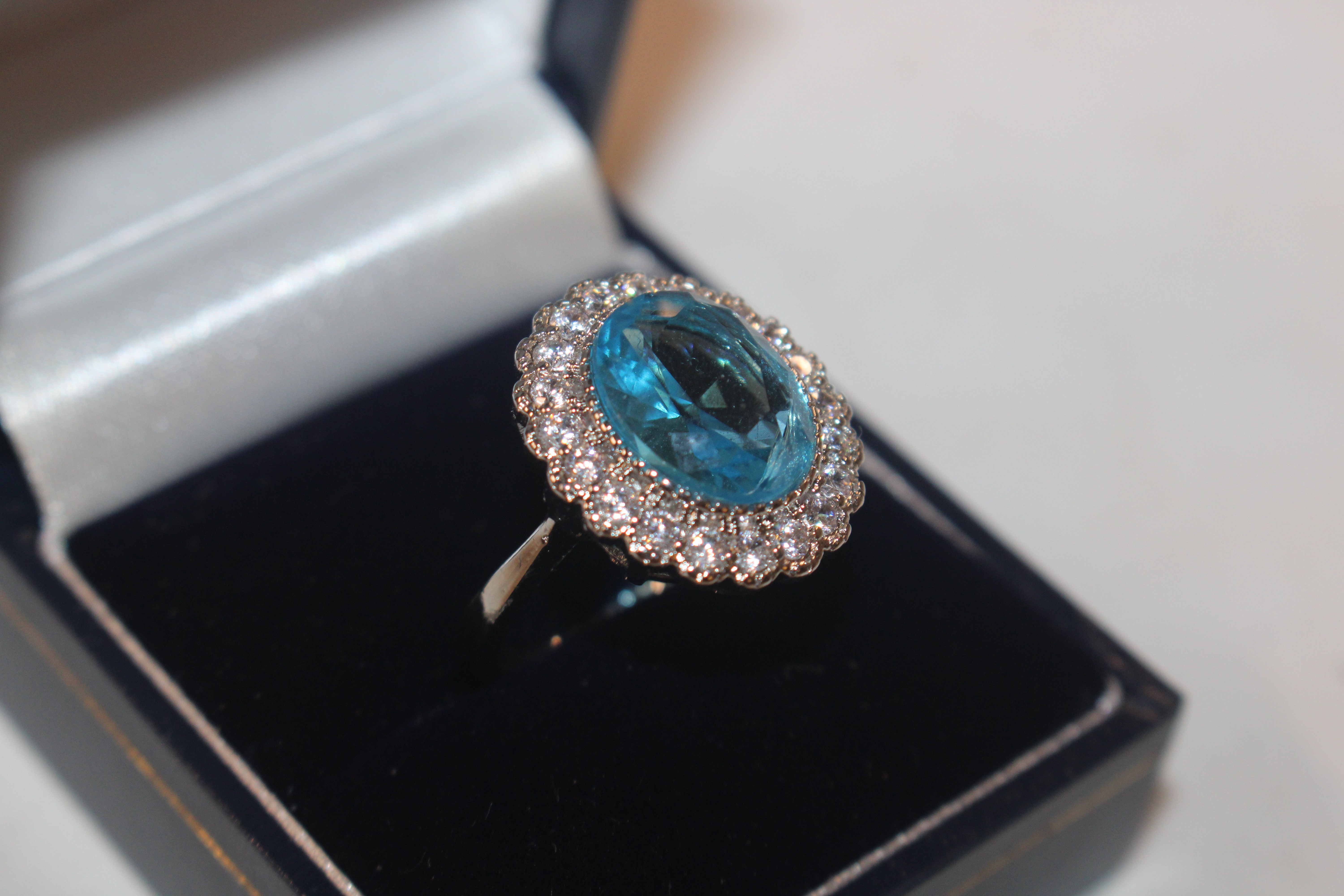 A 925 silver and blue topaz set ring