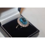 A 925 silver and blue topaz set ring