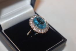 A 925 silver and blue topaz set ring