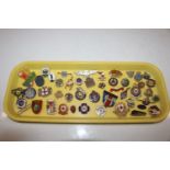 A tray of assorted badges