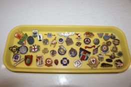 A tray of assorted badges