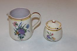 A Poole pottery jug and a Poole pottery preserve p