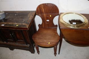 An early 19th Century mahogany hall chair on turne