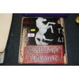 A WWII Auxiliary Fireman plaque mounted on board w