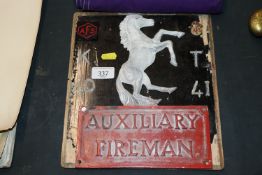 A WWII Auxiliary Fireman plaque mounted on board w