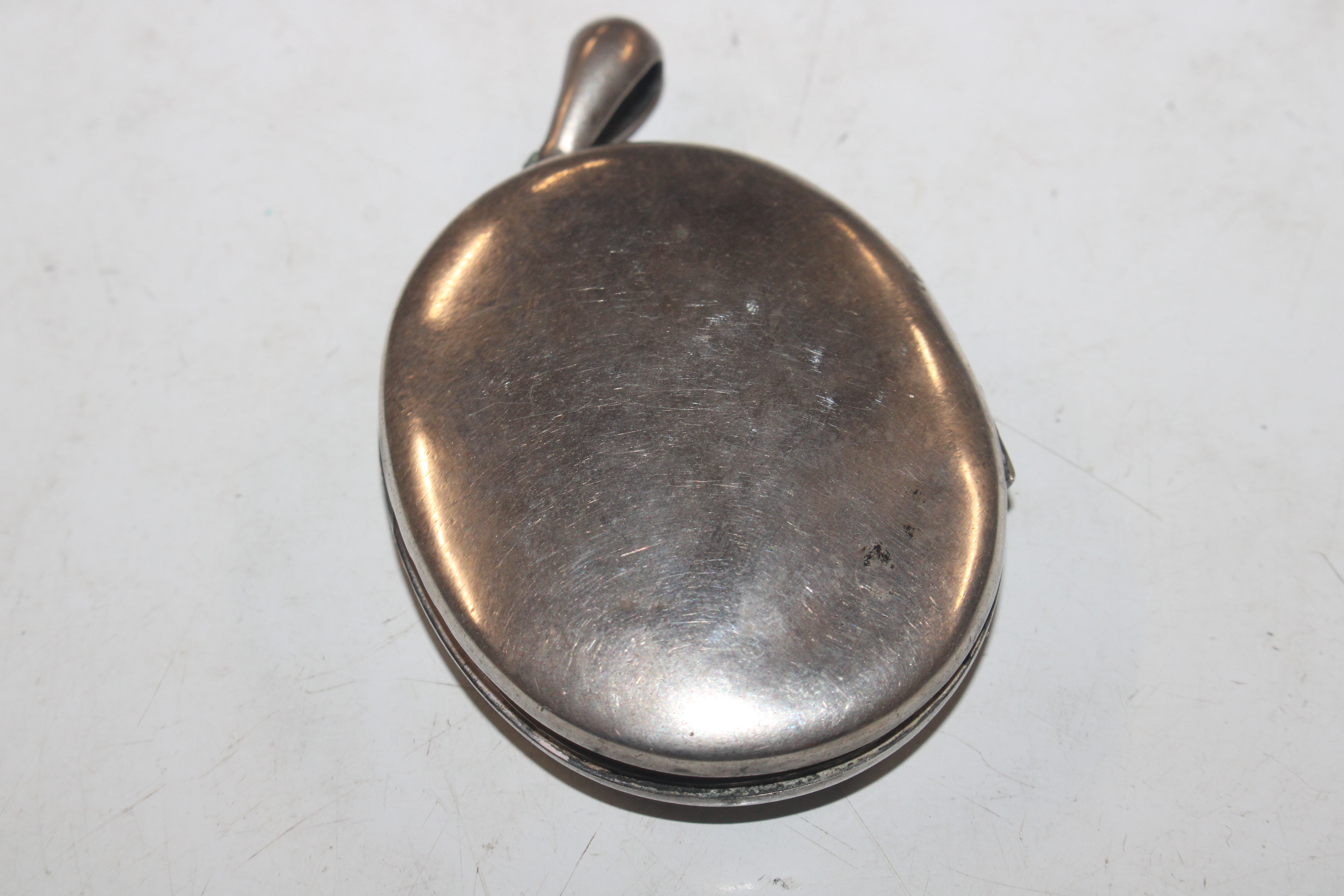 A silver hinged bangle; a white metal locket; a si - Image 3 of 10