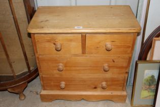 A small pine chest of two short and two long drawe