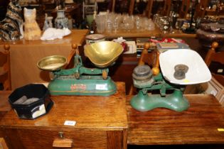 A set of cast iron and brass kitchen scales by J &