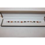 A Sterling silver and amber bracelet