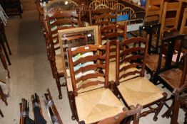 A set of six oak ladder back and rush seated dinin