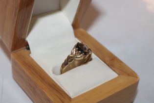 A Hallmarked 9ct gold smoky topaz ring with Celtic