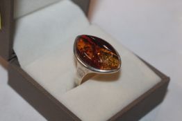 A Sterling silver and amber set ring, ring size N/