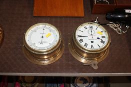 A ship's brass cased bulkhead clock and similar ba