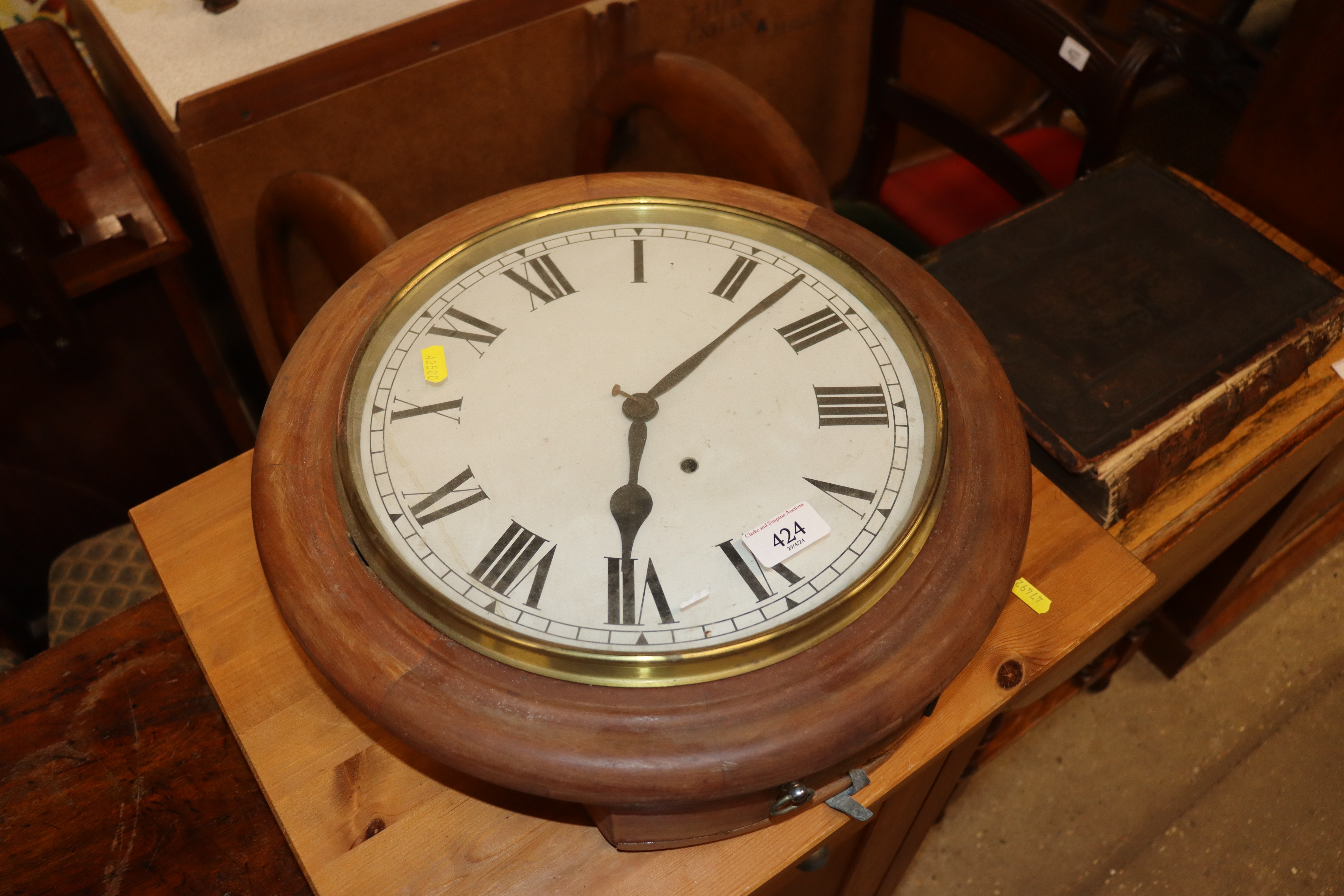 A mahogany cased wall clock with Roman numeral pai