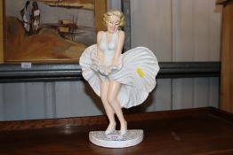 A cast iron door stop in the form of Marilyn Munro