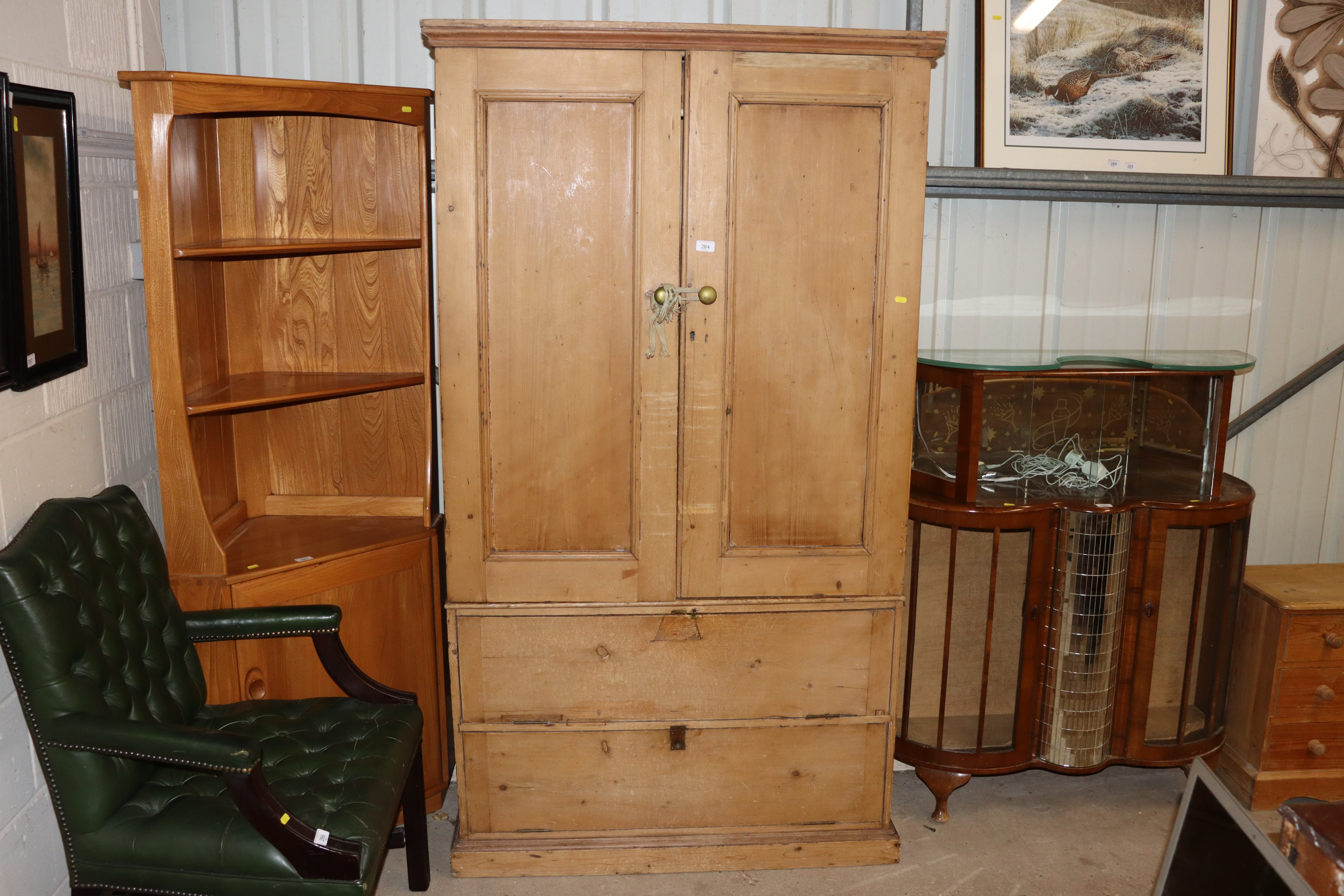 A stripped pine press cupboard