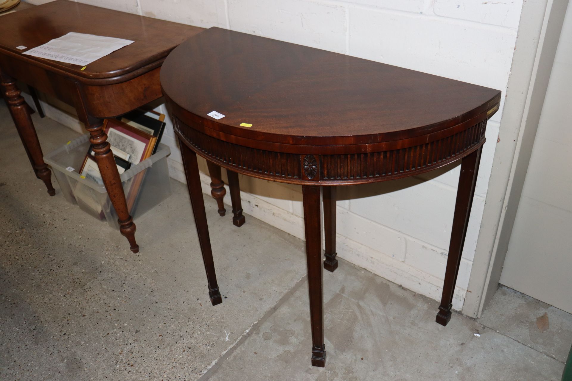 A Georgian style mahogany demi-lune tea table