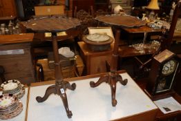 A near pair of mahogany wine tables with pie crust
