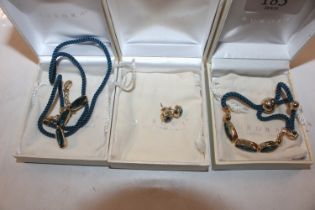 An as new boxed Swarovski Aurora necklace, bracele