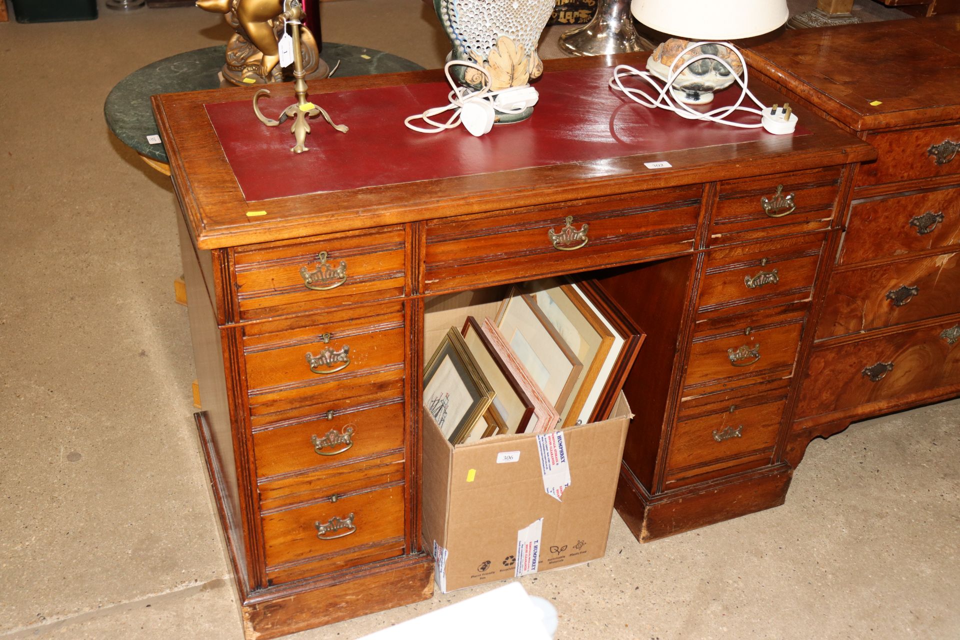 An early 20th Century oak pedestal desk fitted nin