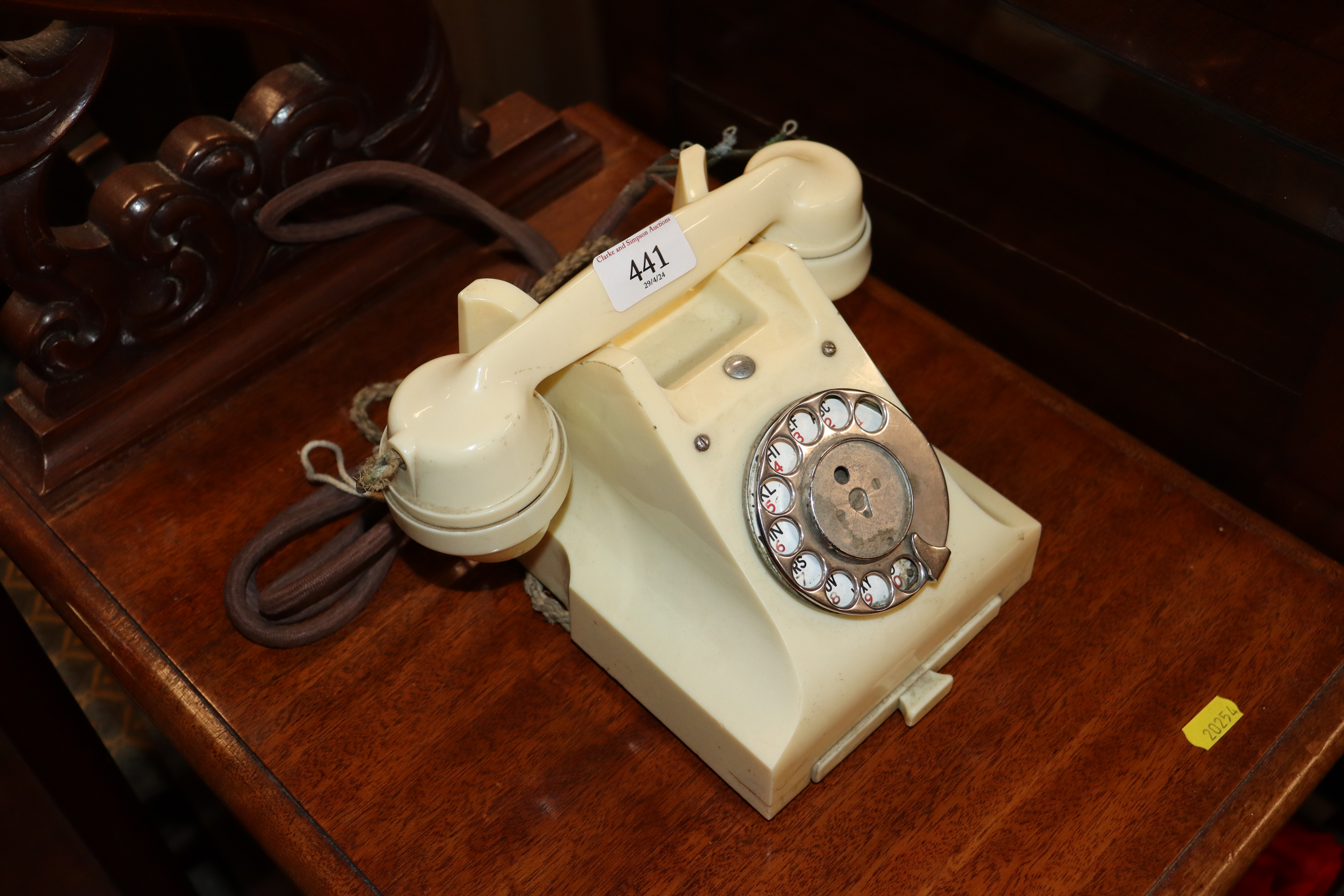 A white vintage dial telephone