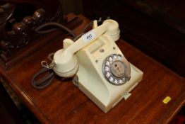 A white vintage dial telephone