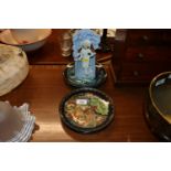 Four collector's plates; and a porcelain figural s