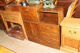 A 1930's oak bookcase / cabinet with drop flap com