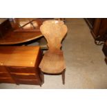 An antique elm hall chair