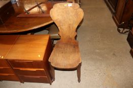 An antique elm hall chair