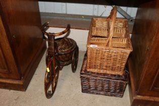A wicker and bamboo tricycle plant stand; a wicker