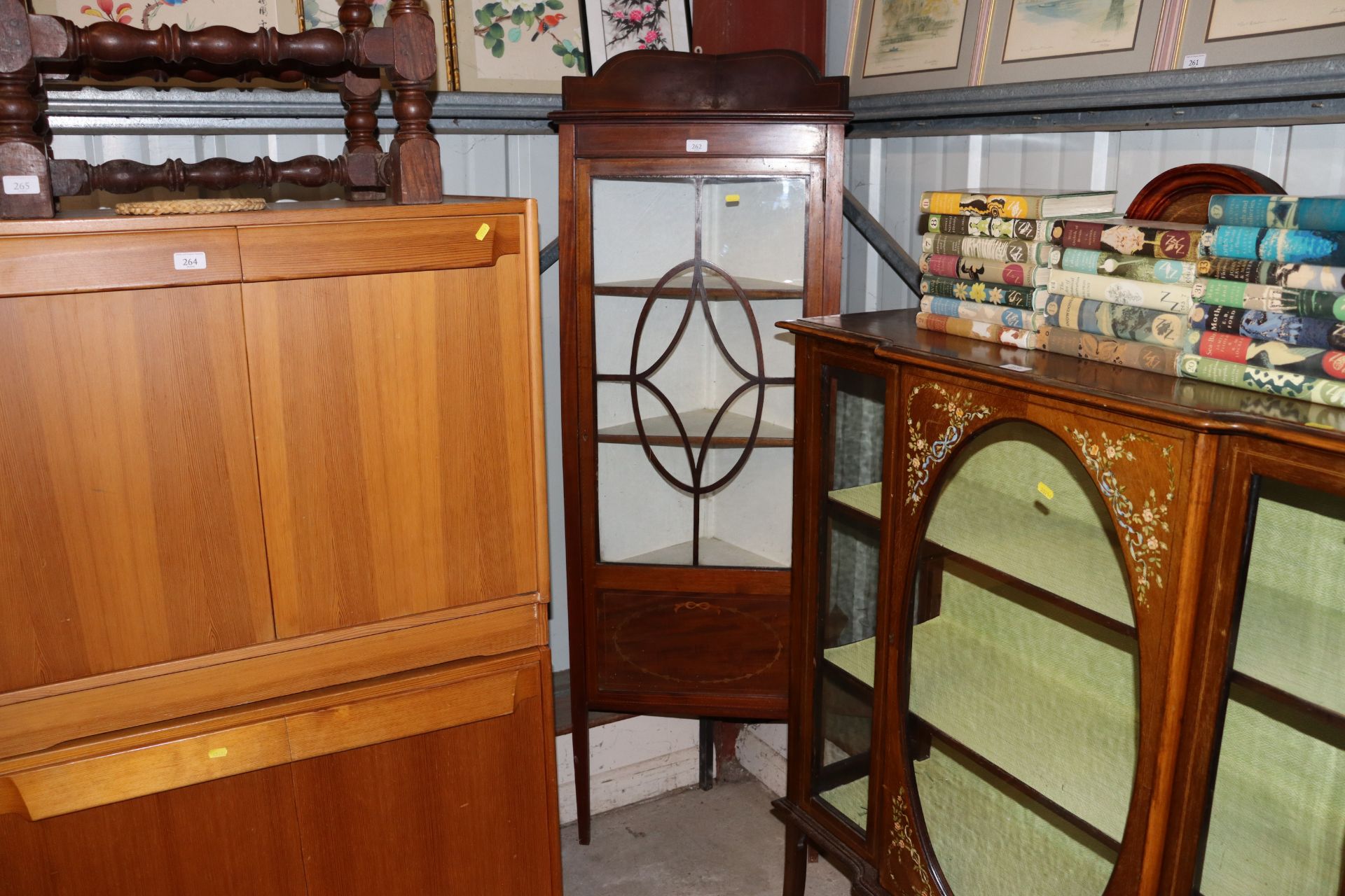 An Edwardian mahogany and inlaid corner display ca