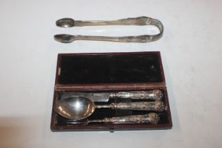 A case containing silver knife, fork and spoon and