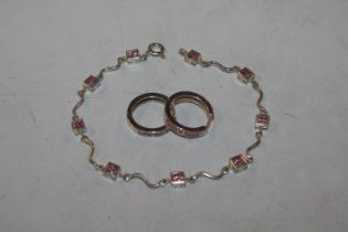 A Sterling silver and pink topaz bracelet and ear-