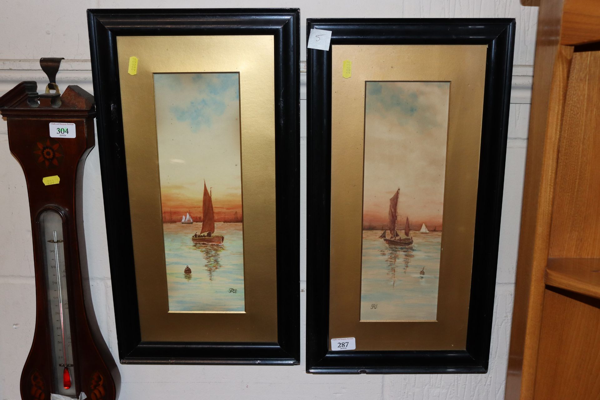 A pair of watercolours depicting sailing boats, signed and dated R.R.T. 1921 in ebonised frames