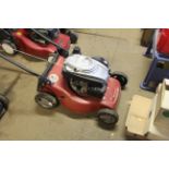 An Einhell GC-PM46 rotary garden lawnmower