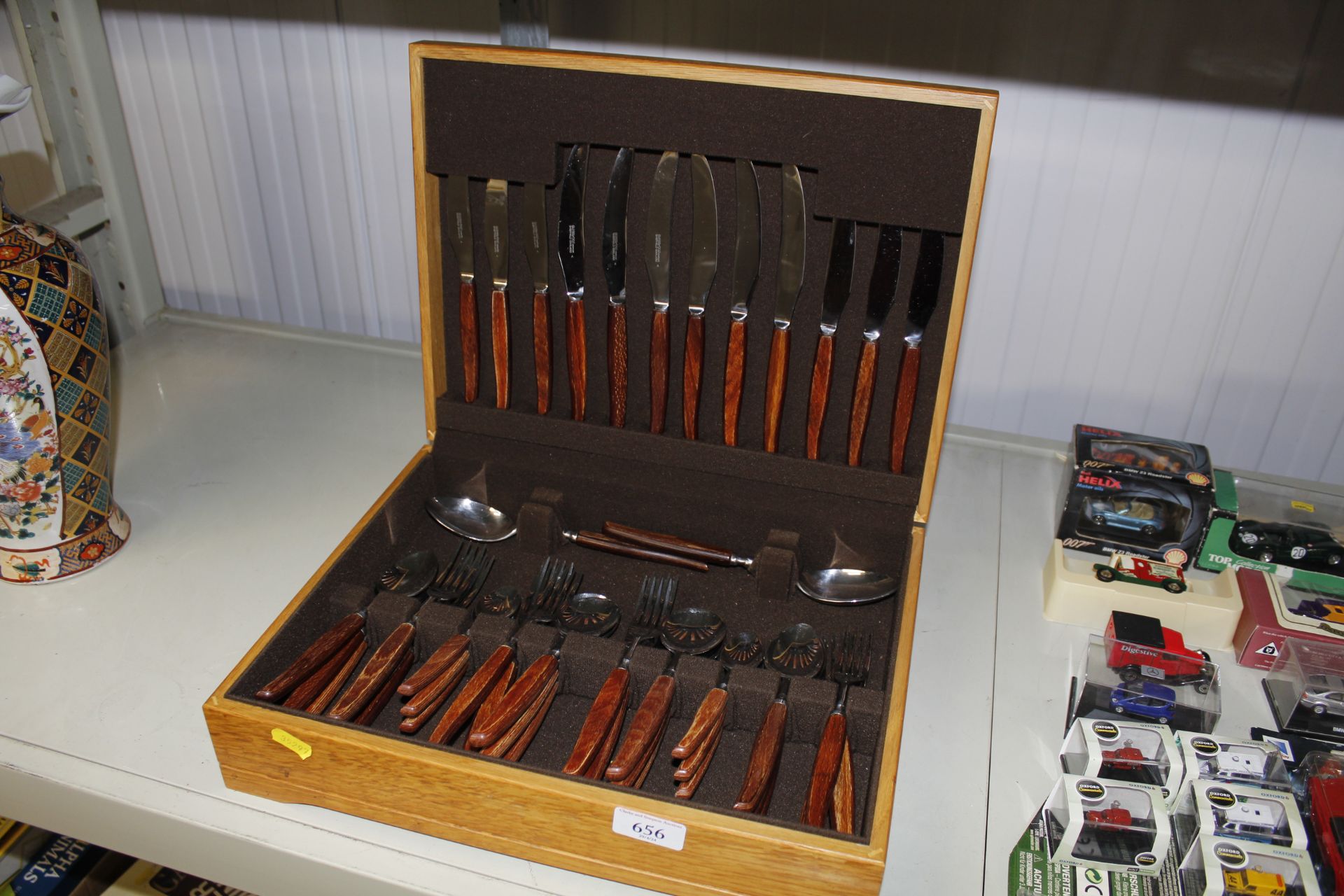 A canteen of gloss wood cutlery