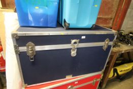 A large blue packing crate